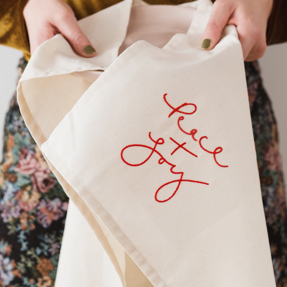 LIMITED QUANTITIES - ‘Peace + Joy’ Cream and Red Embroidered Christmas Tea Towel